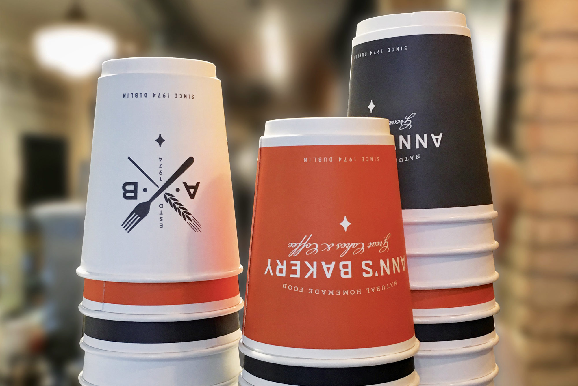Ann's Bakery Great Cakes and Coffee Dublin brand logo on coffee cups.