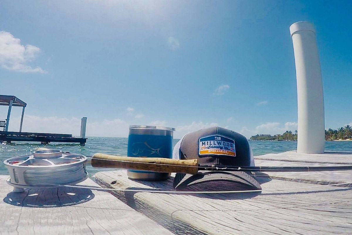 Millwood Brewing Company trucker logo on cap design - with fishing rod on deck. Hat design for craft beer company.